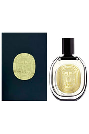 Perfume bottle and packaging with gold emblem on a white background