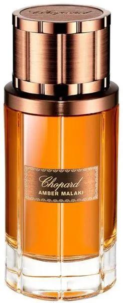 Chopard Amber Malaki perfume bottle with copper cap on a white background