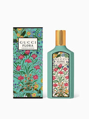 Gucci Flora perfume bottle and packaging with floral design on a white background
