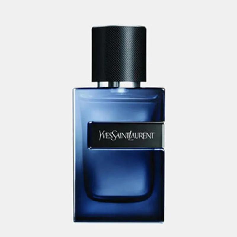 Blue Yves Saint Laurent perfume bottle on a light gray background