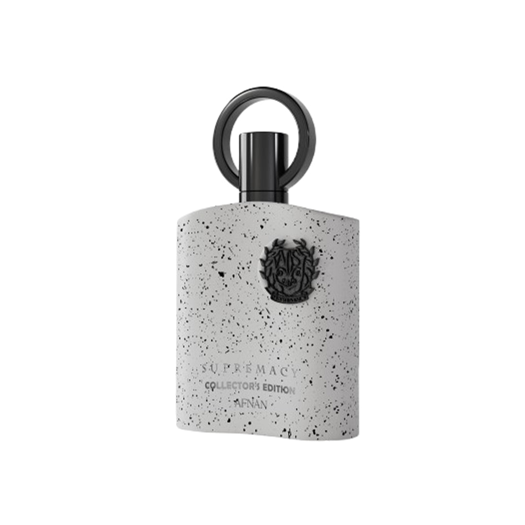 Perfume bottle with speckled design and black cap on a white background