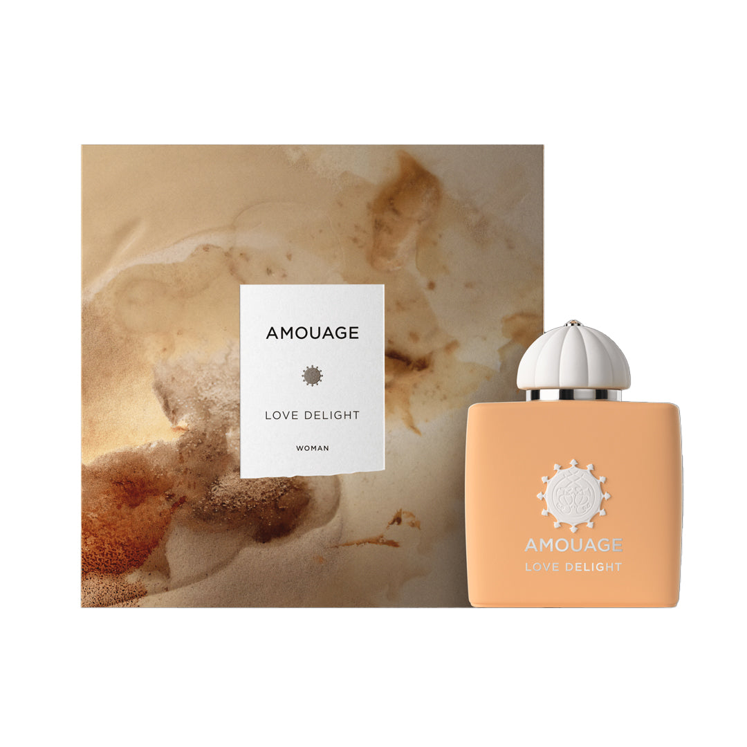 Amouage Love Delight perfume bottle and packaging on a marble background