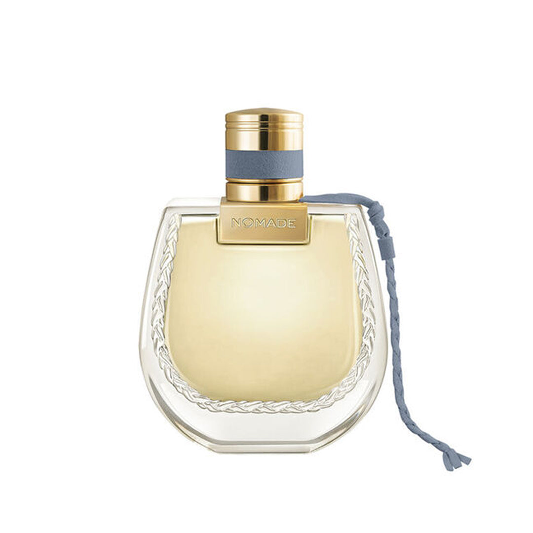 Perfume bottle with gold cap and clear body on a white background