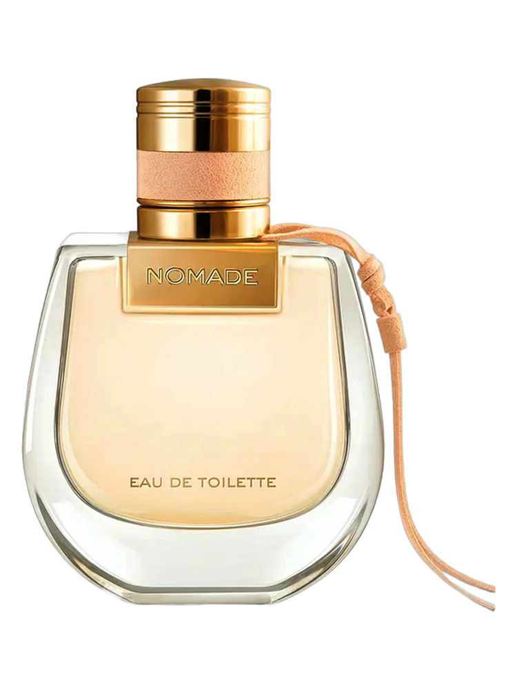 Perfume bottle labeled 'Nomade' with gold cap and ribbon on a white background