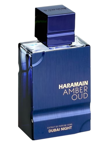 Blue perfume bottle labeled 'Haramain Amber Oud Dubai Night' on a black background