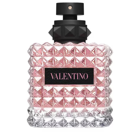 Valentino perfume bottle with pink and clear diamond pattern on a white background