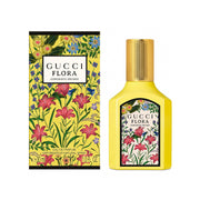 Gucci Flora perfume bottle and packaging with floral design on a white background