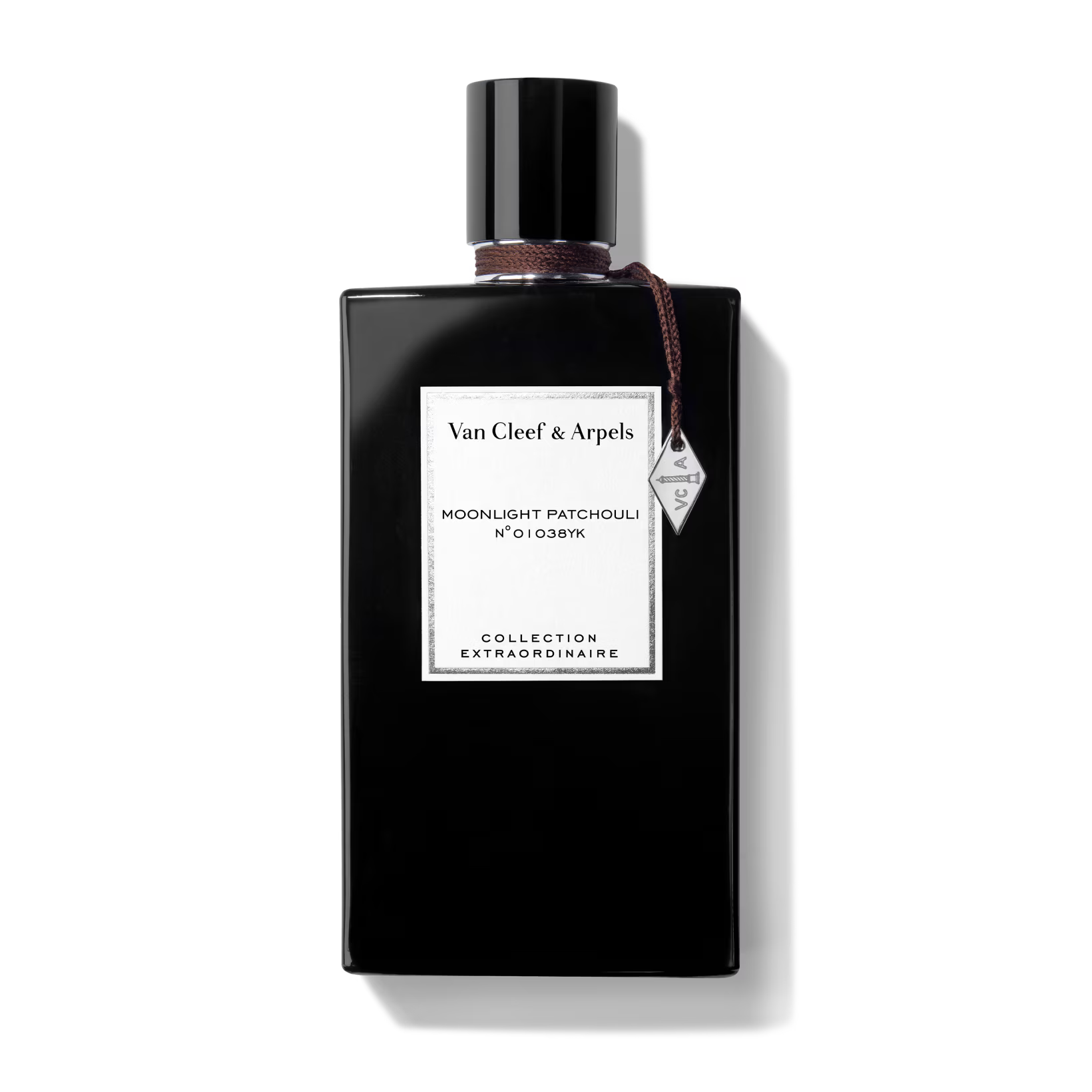 Van Cleef & Arpels perfume bottle with a white label on a black background